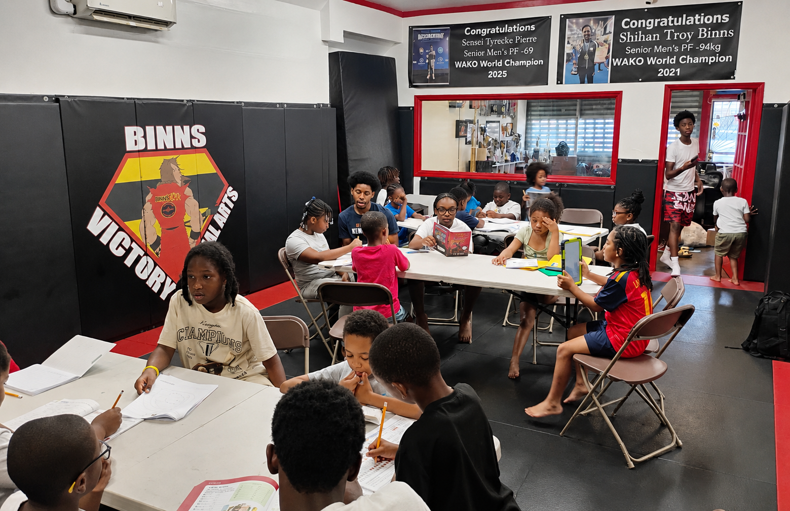 Students doing homework together at Binns Victory Martial Arts